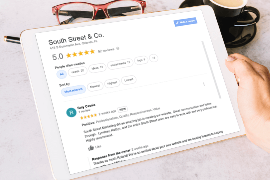 marketing services for service based companies - tablet screen with south street & co google reviews 